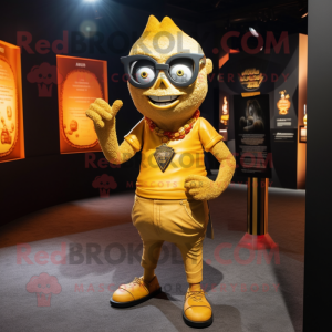 Gold Vampire mascot costume character dressed with a V-Neck Tee and Eyeglasses