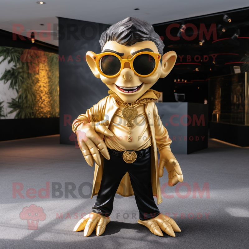 Gold Vampire mascot costume character dressed with a V-Neck Tee and Eyeglasses Gold Vampire mascot costume character dressed with a V-Neck Tee and Eyeglasses