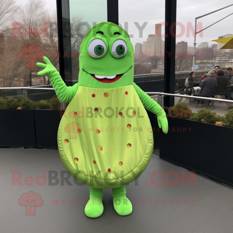 Lime Green Bagels mascot costume character dressed with a Empire Waist Dress and Foot pads Lime Green Bagels mascot costume character dressed with a Empire Waist Dress and Foot pads
