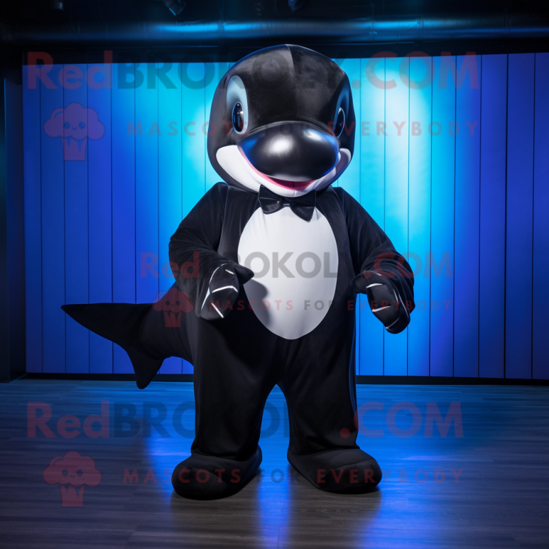 Black Killer Whale mascot costume character dressed with a Bermuda Shorts and Bow ties