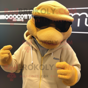 Tan Komodo Dragon mascot costume character dressed with a Sweatshirt and Eyeglasses