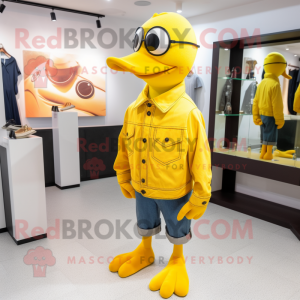 Yellow Gull mascot costume character dressed with a Flare Jeans and Rings