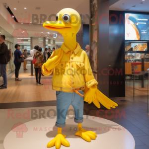 Yellow Gull mascot costume character dressed with a Flare Jeans and Rings