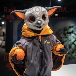 Orange Fruit Bat mascot costume character dressed with a Bomber Jacket and Gloves