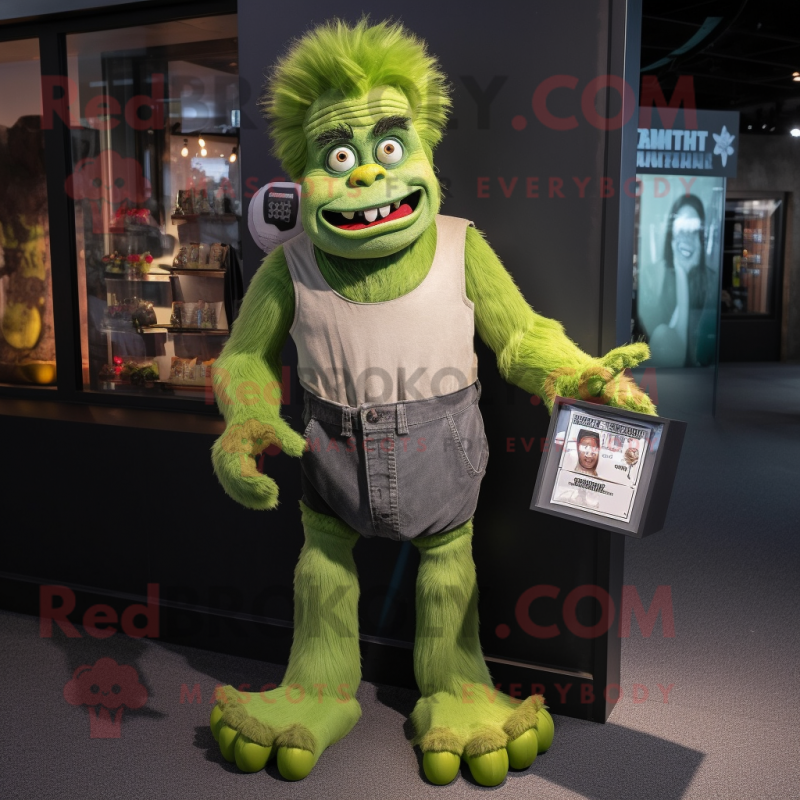 Green Frankenstein mascot costume character dressed with a T-Shirt and Coin purses Green Frankenstein mascot costume character dressed with a T-Shirt and Coin purses