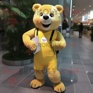 Yellow Bear mascot costume character dressed with a Running Shorts and Coin purses