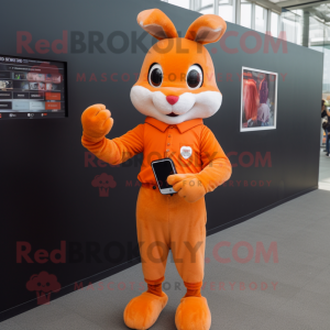 Orange Rabbit mascot costume character dressed with a Sheath Dress and Smartwatches