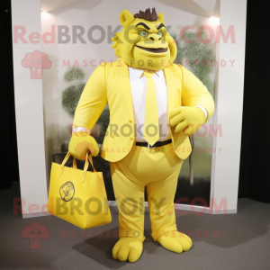 Lemon Yellow Ogre mascot costume character dressed with a Blazer and Tote bags