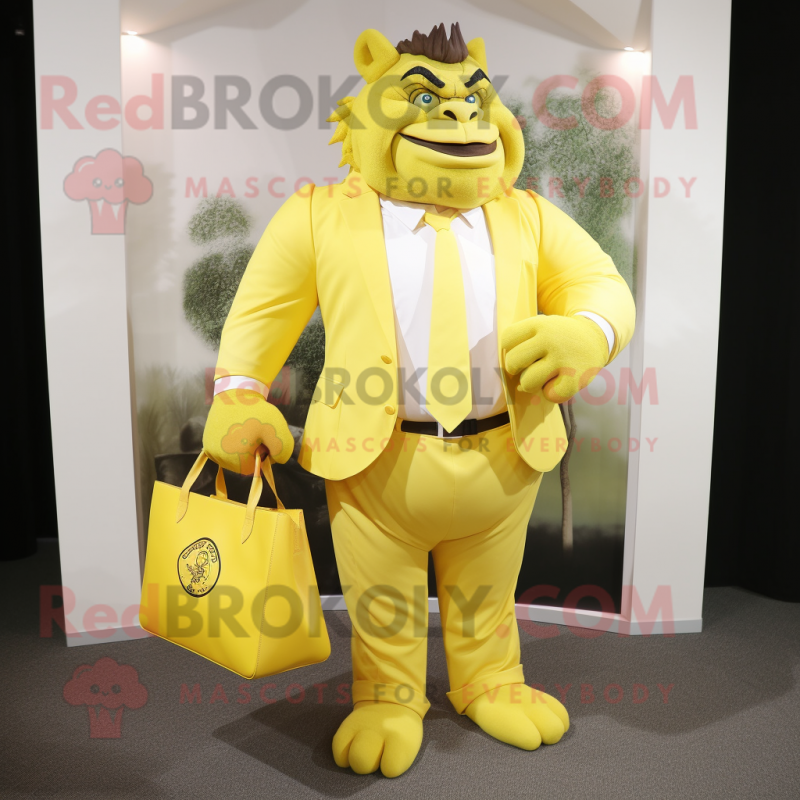 Lemon Yellow Ogre mascot costume character dressed with a Blazer and Tote bags Lemon Yellow Ogre mascot costume character dressed with a Blazer and Tote bags