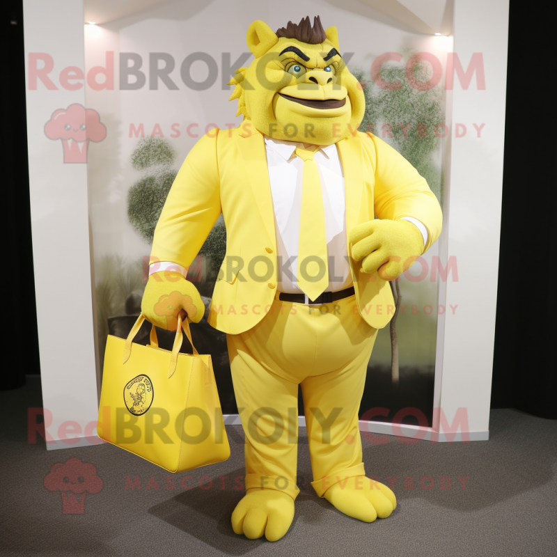 Lemon Yellow Ogre mascot costume character dressed with a Blazer and Tote bags