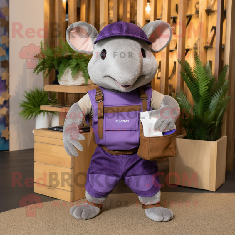 Purple Armadillo mascot costume character dressed with a Dungarees and Messenger bags
