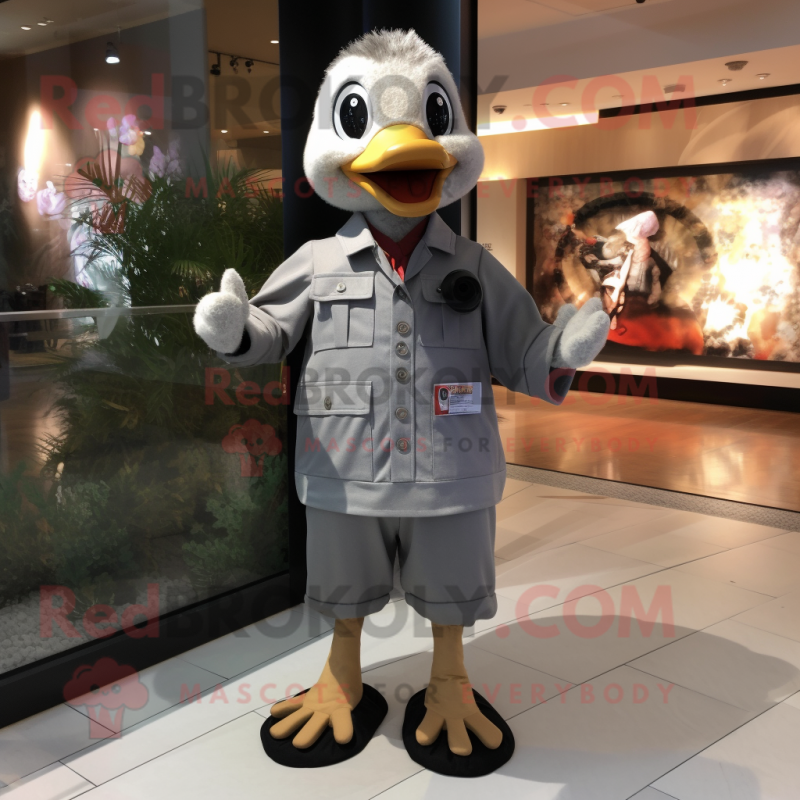 Gray Geese mascot costume character dressed with a Romper and Tie pins Gray Geese mascot costume character dressed with a Romper and Tie pins