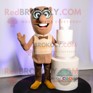 Tan Wedding Cake mascot costume character dressed with a Skinny Jeans and Reading glasses