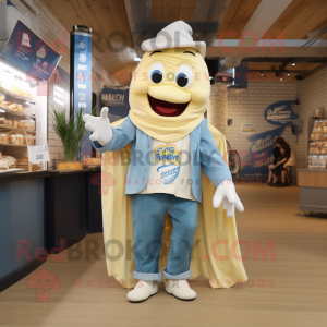 Cream Fish And Chips mascot costume character dressed with a Denim Shirt and Shawls