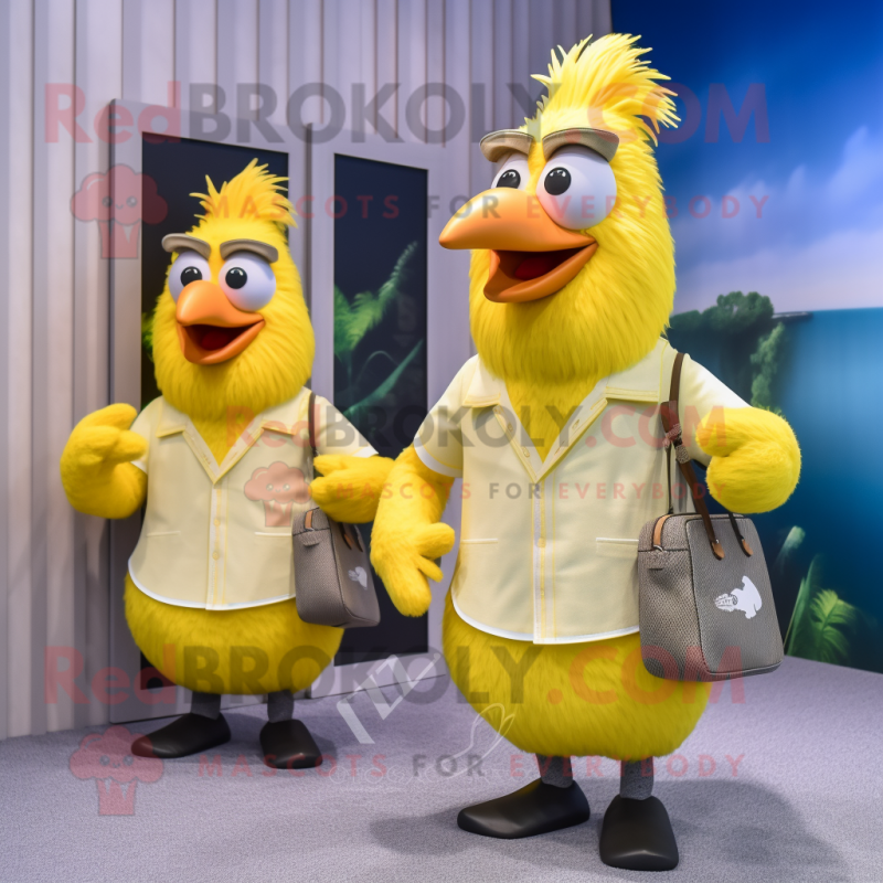Lemon Yellow Roosters mascot costume character dressed with a Board Shorts and Messenger bags
