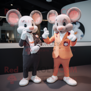 Peach Mouse mascot costume character dressed with a Blazer and Smartwatches