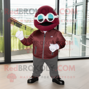 Maroon Cucumber mascot costume character dressed with a Biker Jacket and Headbands