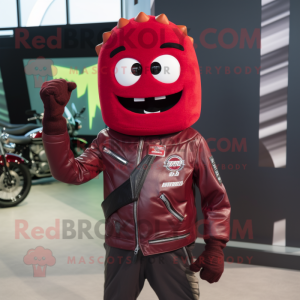 Maroon Cucumber mascot costume character dressed with a Biker Jacket and Headbands