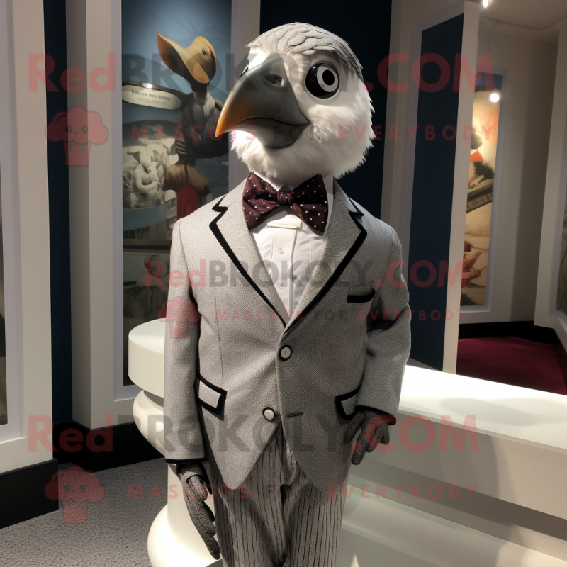 Silver Quail mascot costume character dressed with a Blazer and Bow ties