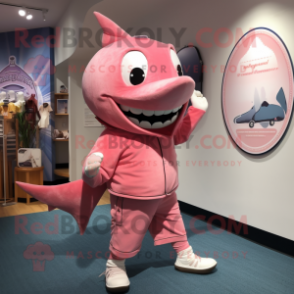 Pink Swordfish mascot costume character dressed with a Henley Shirt and Shoe laces