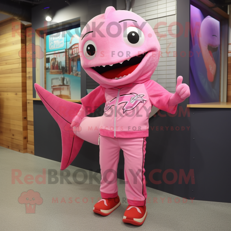 Pink Swordfish mascot costume character dressed with a Henley Shirt and Shoe laces