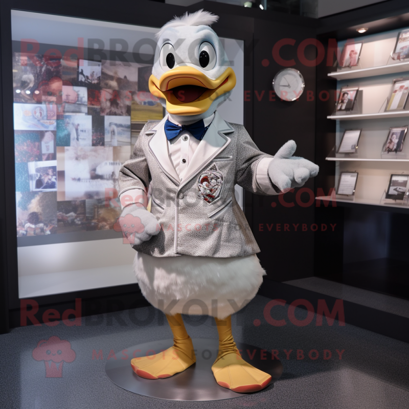 Silver Duck mascot costume character dressed with a Poplin Shirt and Lapel pins