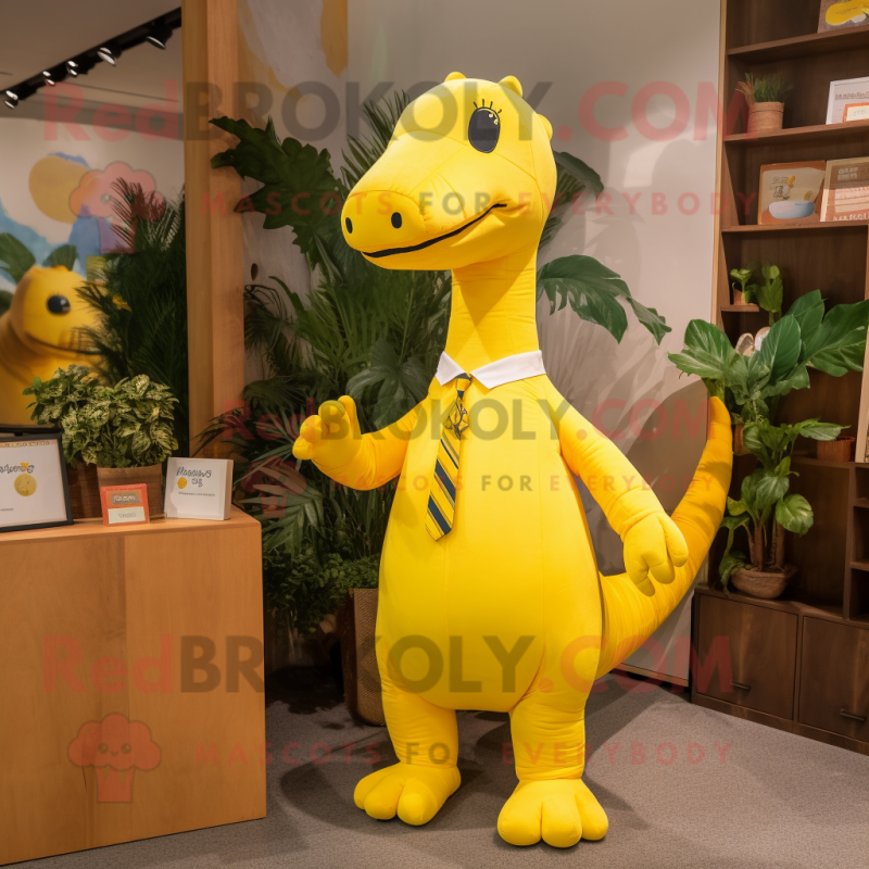 Yellow Diplodocus mascot costume character dressed with a Leggings and Pocket squares