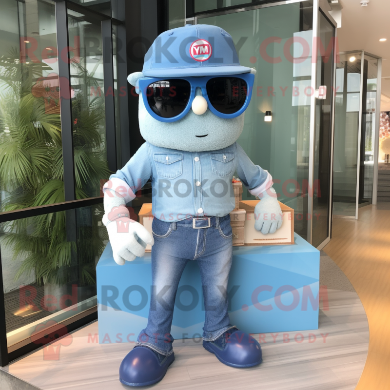 Blue Wedding Cake mascot costume character dressed with a Denim Shirt and Sunglasses Blue Wedding Cake mascot costume character dressed with a Denim Shirt and Sunglasses