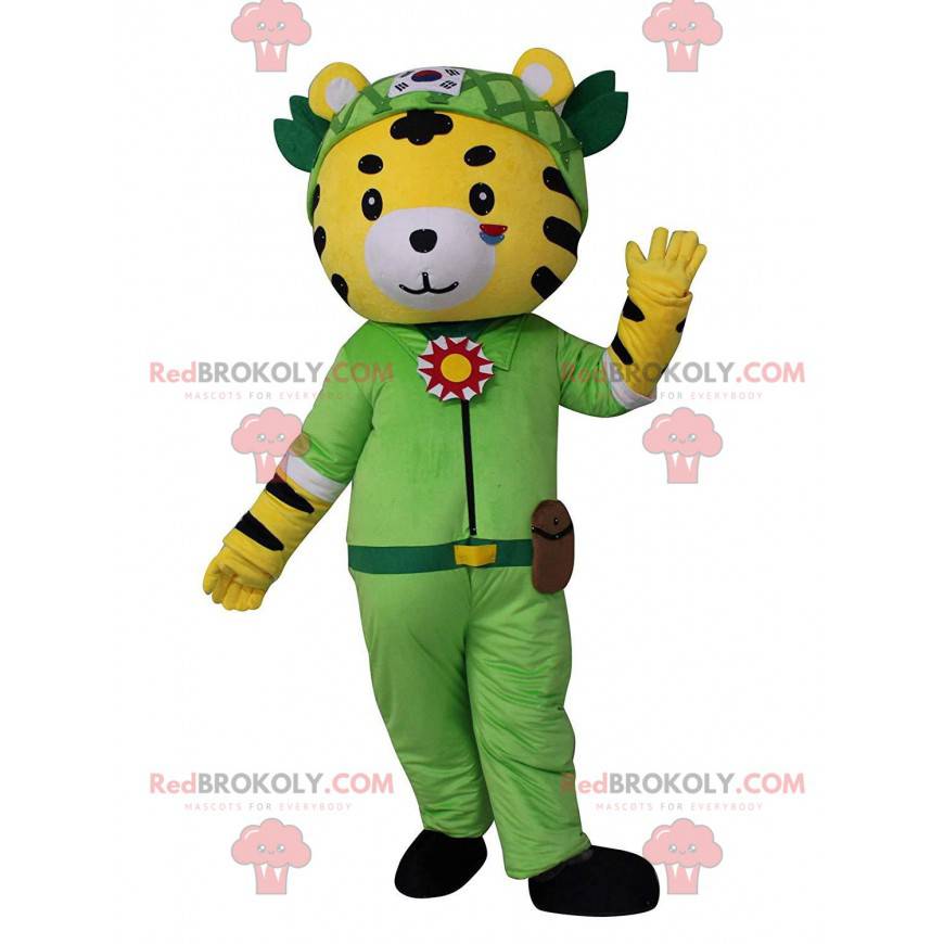 Yellow, white and black tiger mascot in adventurer outfit -