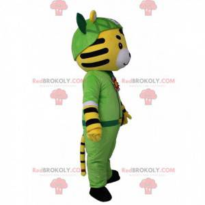 Yellow, white and black tiger mascot in adventurer outfit -