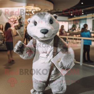 Silver Otter mascot costume character dressed with a T-Shirt and Clutch bags