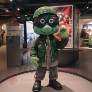 Green Camera mascot costume character dressed with a Bomber Jacket and Keychains