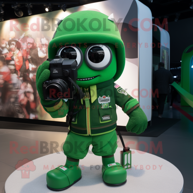 Green Camera mascot costume character dressed with a Bomber Jacket and Keychains