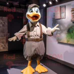 Gray Duck mascot costume character dressed with a Poplin Shirt and Suspenders