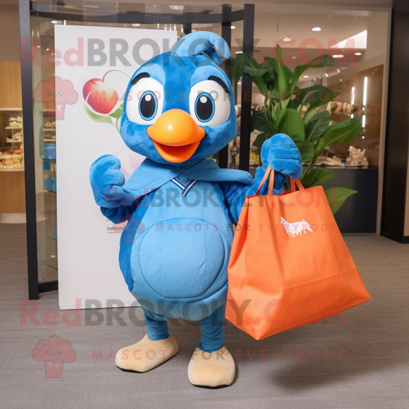 Peach Blue Jay mascot costume character dressed with a Windbreaker and Tote bags