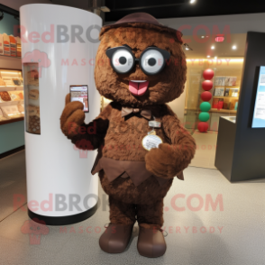 Brown Candy mascot costume character dressed with a Henley Shirt and Reading glasses