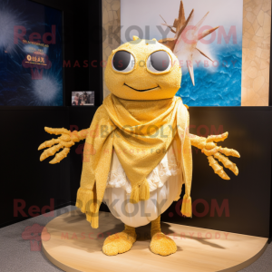 Gold Crab Cakes mascot costume character dressed with a Swimwear and Shawls
