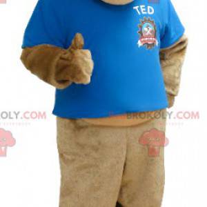 Beige tiger mascot with a blue t-shirt - Redbrokoly.com