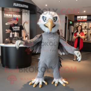 Silver Haast'S Eagle mascot costume character dressed with a T-Shirt and Rings