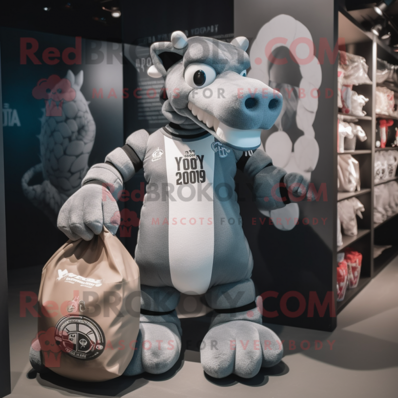 Gray Hydra mascot costume character dressed with a Rugby Shirt and Tote bags Gray Hydra mascot costume character dressed with a Rugby Shirt and Tote bags