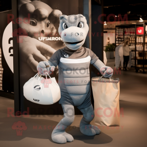 Gray Hydra mascot costume character dressed with a Rugby Shirt and Tote bags