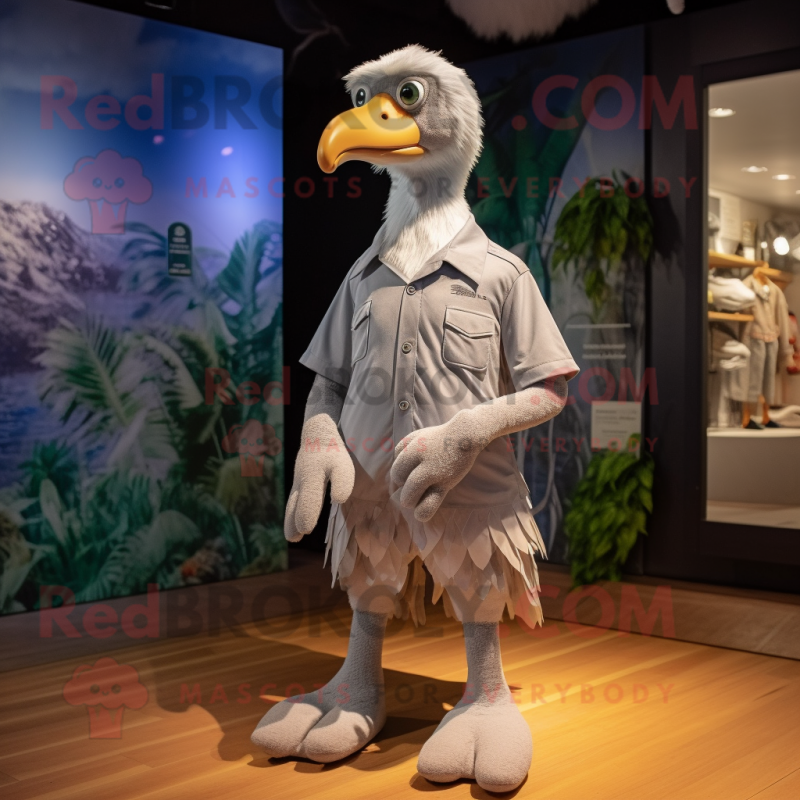 Gray Albatross mascot costume character dressed with a Polo Tee and Shoe laces Gray Albatross mascot costume character dressed with a Polo Tee and Shoe laces