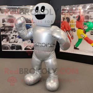 Silver Boxing Glove mascot costume character dressed with a Swimwear and Shoe laces