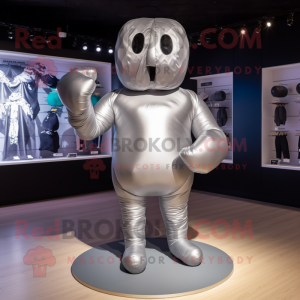 Silver Boxing Glove mascot costume character dressed with a Swimwear and Shoe laces