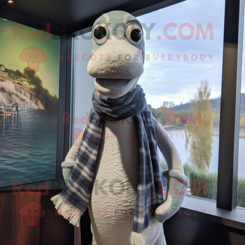 Silver Loch Ness Monster mascot costume character dressed with a ...