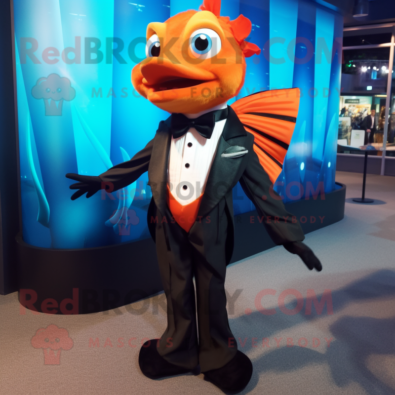 Orange Betta Fish mascot costume character dressed with a Tuxedo and Ties