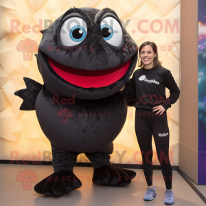 Black Piranha mascot costume character dressed with a Yoga Pants and Shoe clips