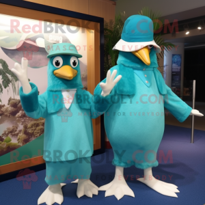 Turquoise Albatross mascot costume character dressed with a A-Line Dress and Berets