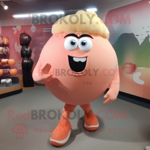 Peach Cyclops mascot costume character dressed with a Yoga Pants and Shoe laces