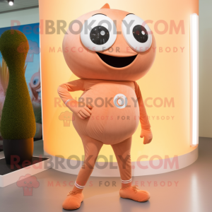 Peach Cyclops mascot costume character dressed with a Yoga Pants and Shoe laces